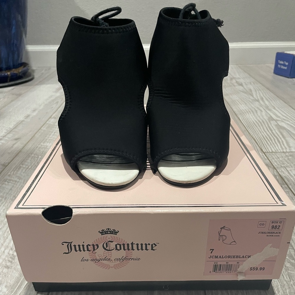 Juicy Couture size 7 black heals with the in back. Super comfortable.